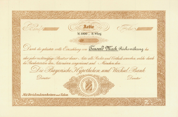 Altes Aktienzertifikat mit goldenem Rand, das ein Porträt eines Mannes und Text zeigt, wahrscheinlich eine Anleihe.