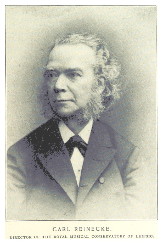 Schwarz-weiß-Portr├Ąt von Carl Reinecke, ein Mann in einem Anzug, der sitzt und leicht nach links schaut, mit Text unten.