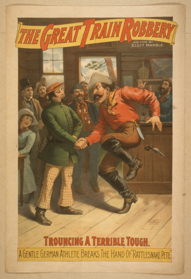 Plakat zeigt eine Gruppe von Menschen auf einem Boden mit einer Person, die eine Waffe hält, ein Fenster und eine Wand im Hintergrund und den Text "The Great Train Robbery - Trouching a Terrible Tough" oben und unten.