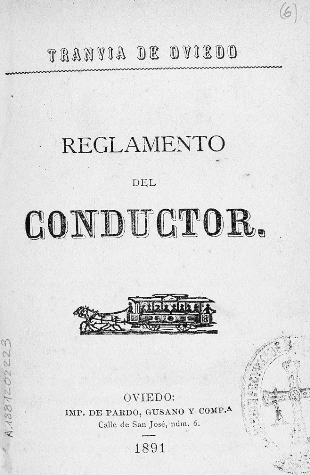 Altes Buch mit dem Titel "Reglamento de Conductor" und einer Zeichnung eines Zugs auf dem Titelbild und einem Stempel auf der rechten Seite.